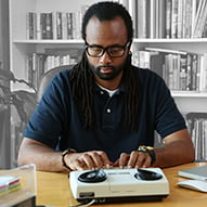 An adult African American male using TTY Relay.